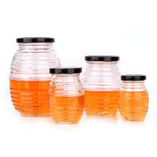 Wholesale 100ml 180ml 380ml 730ml threaded bee shape honey glass jar containers with screw lid